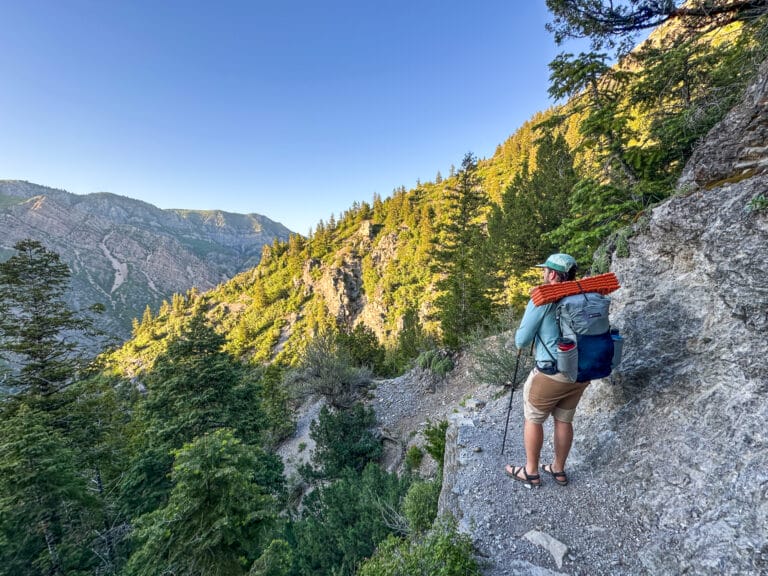A man stands on Indian Trail in Ogden with the Gossamer Gear Skala 38 backpack on his back.